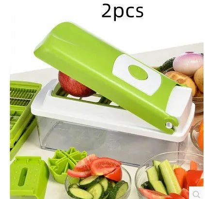 Green 12-piece manual vegetable chopper and food dicer set with stainless steel blades on a kitchen counter.