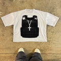 Man wearing a printed retro style cotton t-shirt with drop shoulder sleeves in a graphic design.