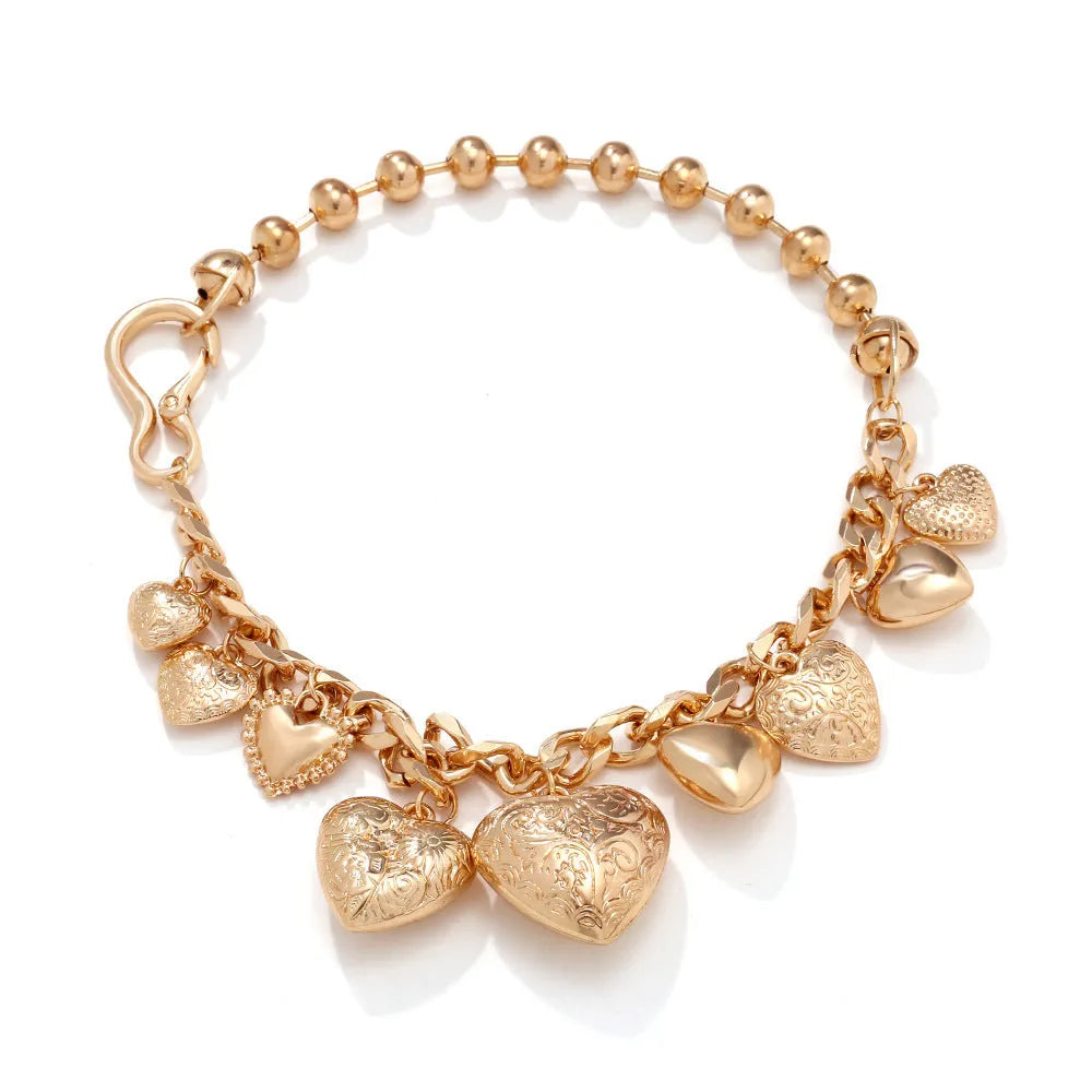Gold carved heart pendant necklace on adjustable metal chain for women