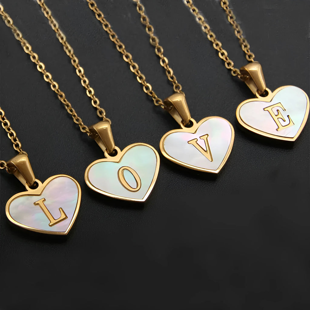 Personalised white shell heart necklace with gold chain and initial letter engraving