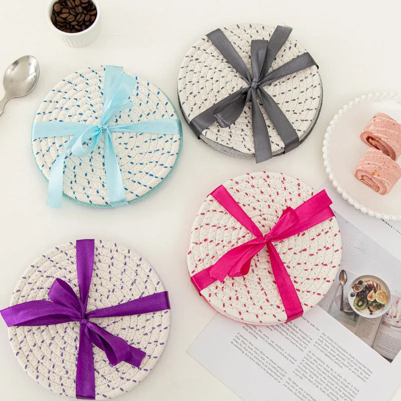 Three round cotton cord coasters in blue colour showing 18cm diameter measurement