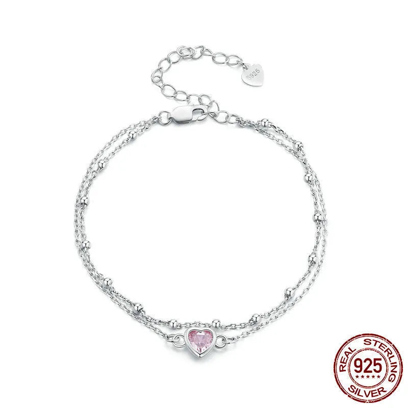 Sweet girlish 925 sterling silver bracelet with small heart-shaped pendant on an adjustable chain.