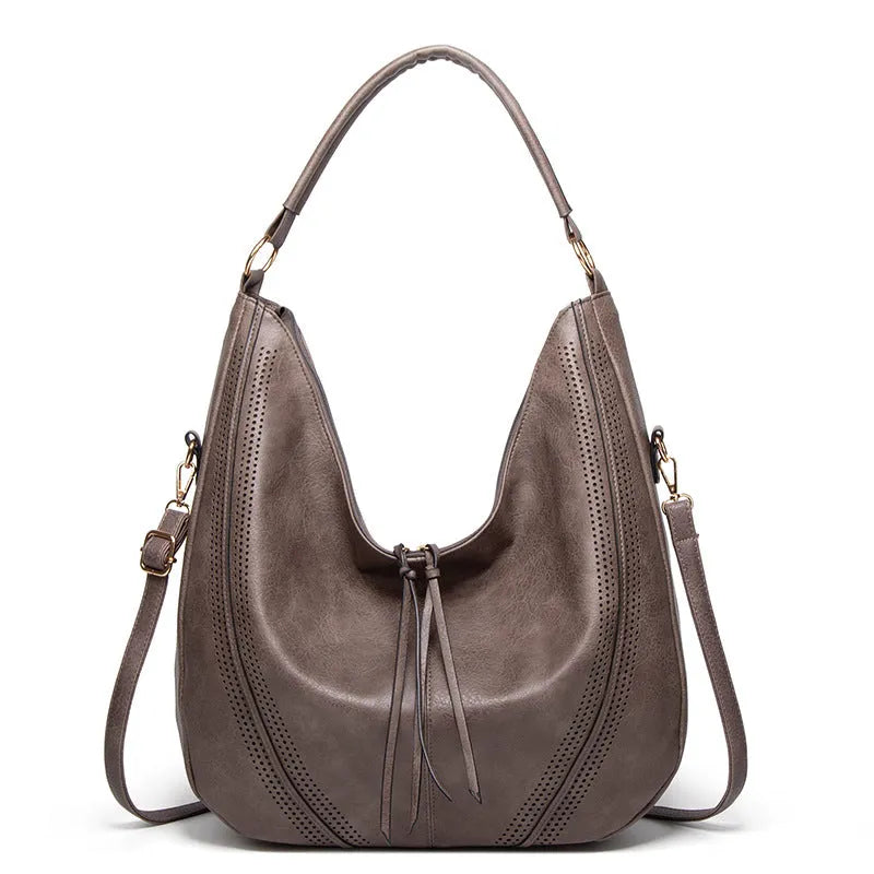 Women's soft PU leather tassel hollow shoulder bag in vertical square shape with sewing line details, black colour