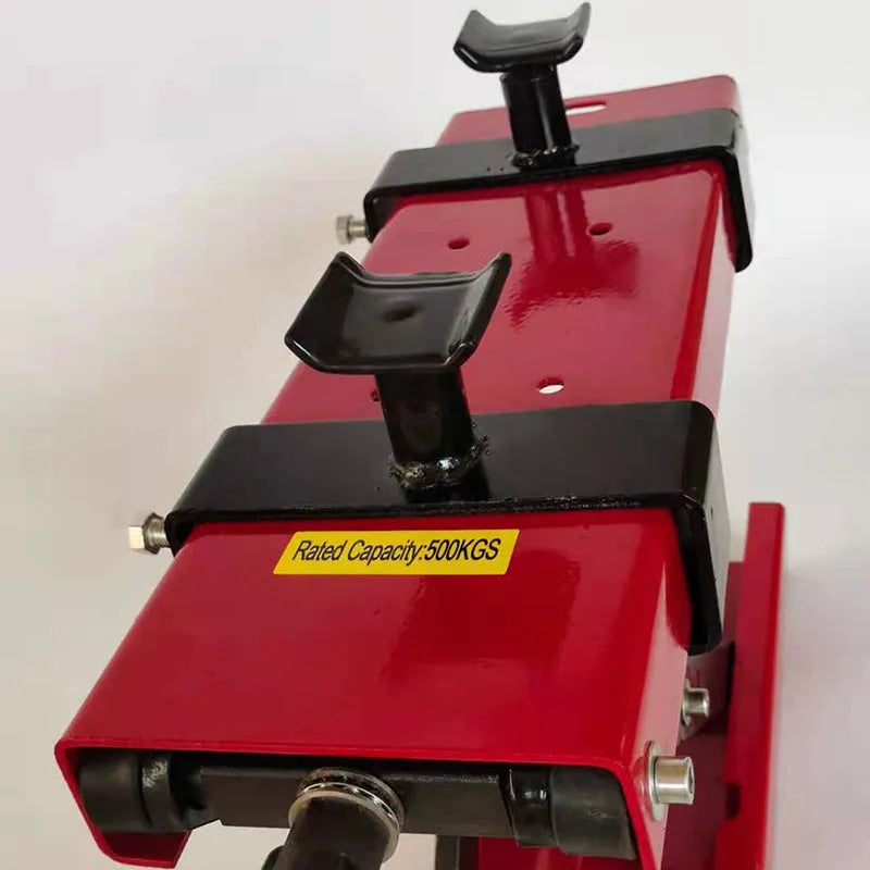Red motorcycle support lift table raising a bike 16 inches above the ground for repair work
