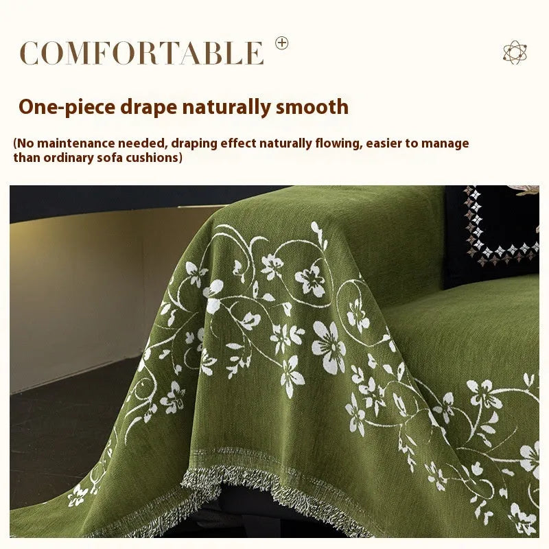 Chenille sofa cover with embroidered magnolia pattern in garland black, coffee, and green colours