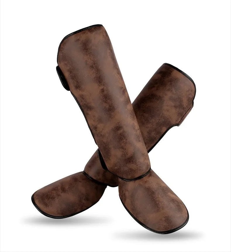 PU vertical thickened fighting boxing shin guards in brown colour on training mat