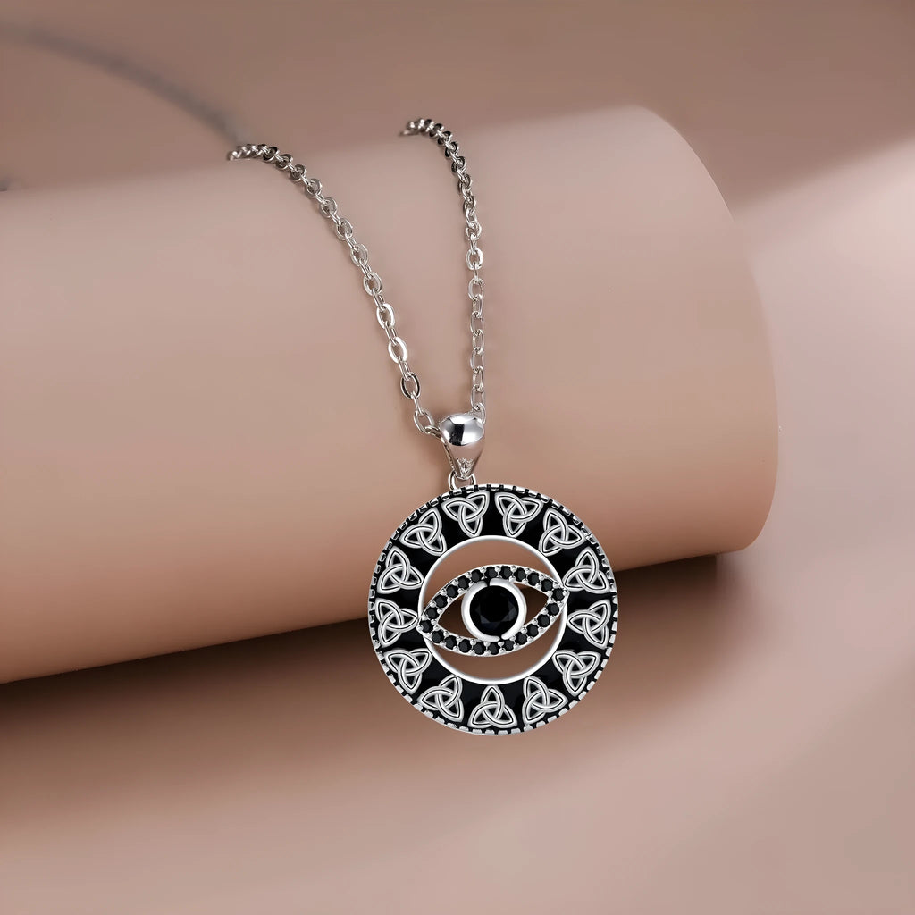 Copper Devil's Eye necklace with cross chain style pendant and electroplated finish.