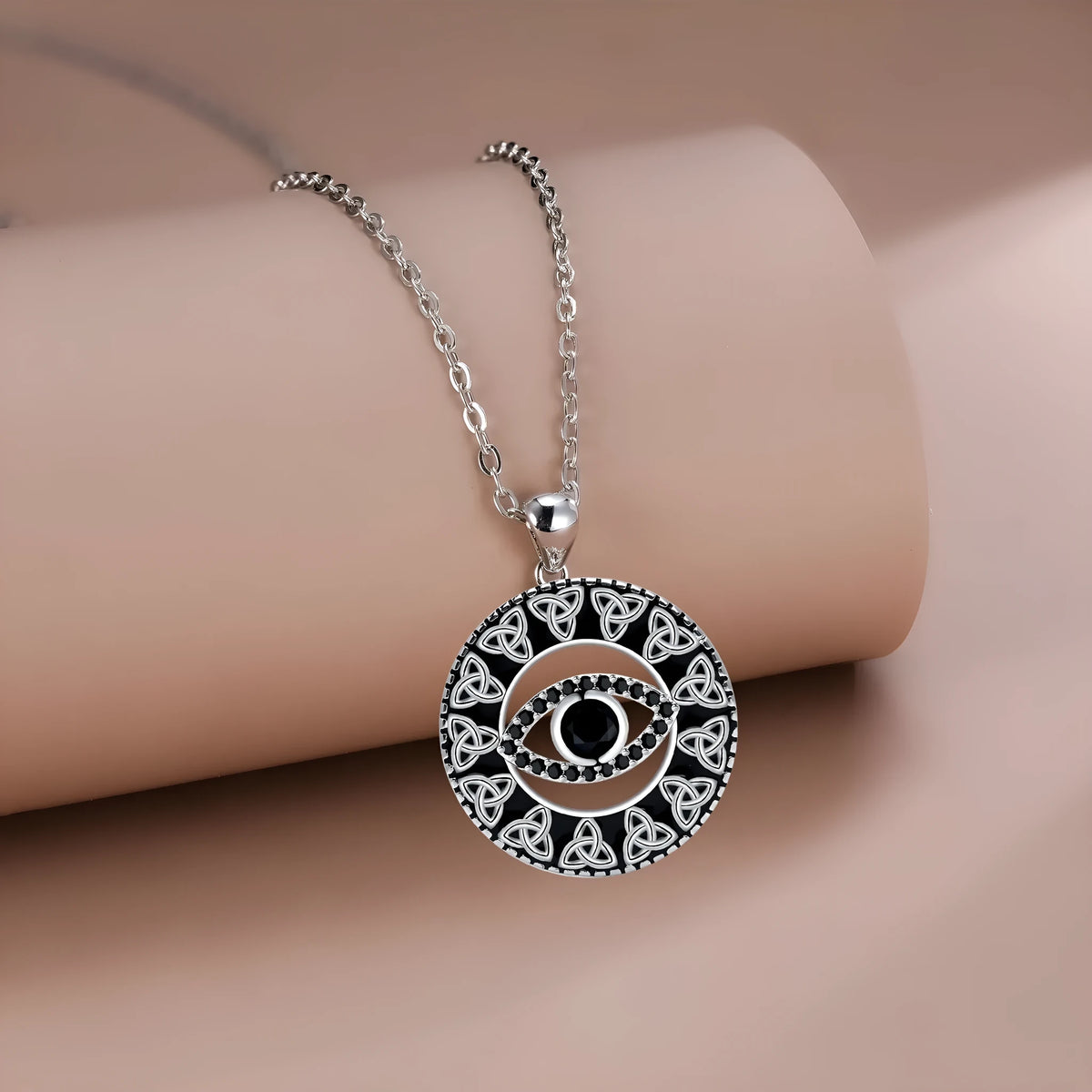 Copper Devil's Eye necklace with cross chain style pendant and electroplated finish.
