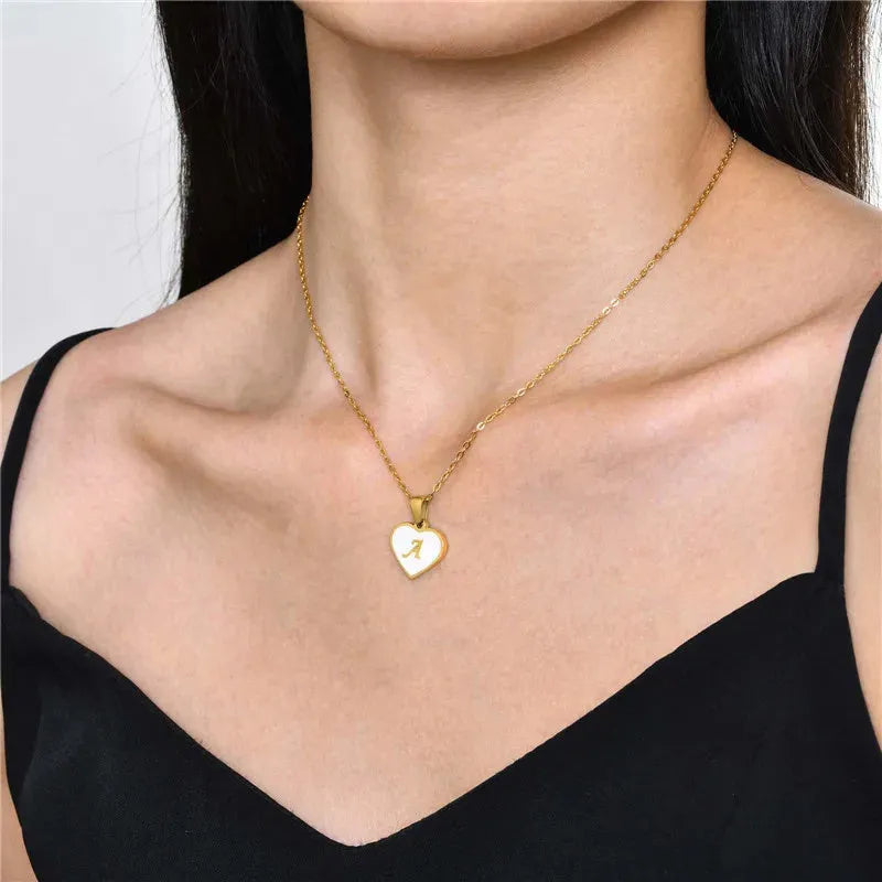 Personalised white shell heart necklace with gold chain and initial letter engraving