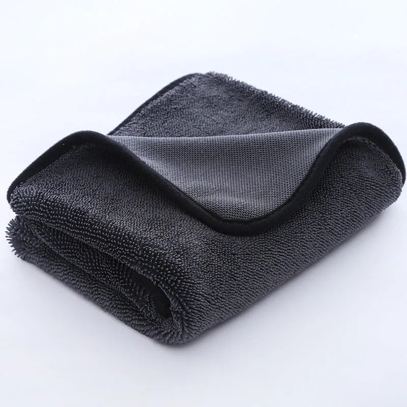 Grey car cleaning microfibre towel with a twisted braid edge, shown in various sizes for washing glass.