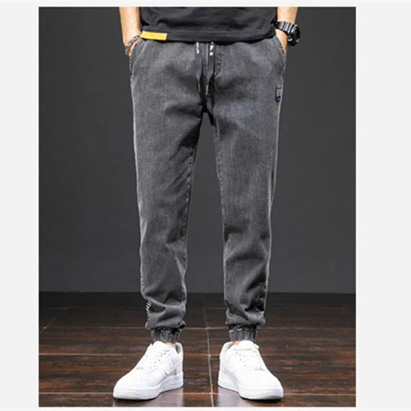 Men's casual loose stretch cotton jeans in black, available in sizes M to 8XL for relaxed daily wear