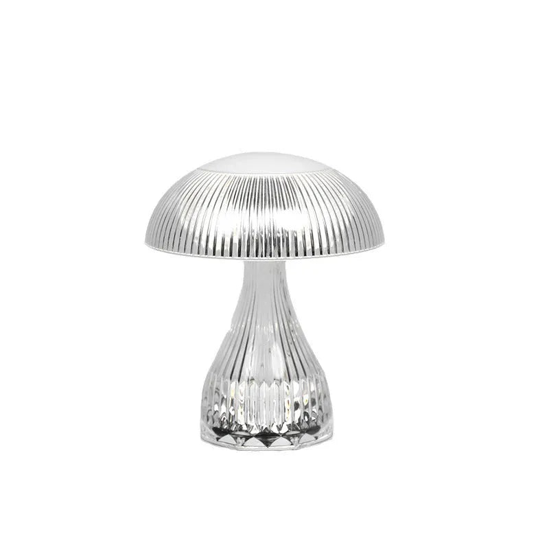 Small white rechargeable table lamp with acrylic body and USB cable, showing three colour light settings.