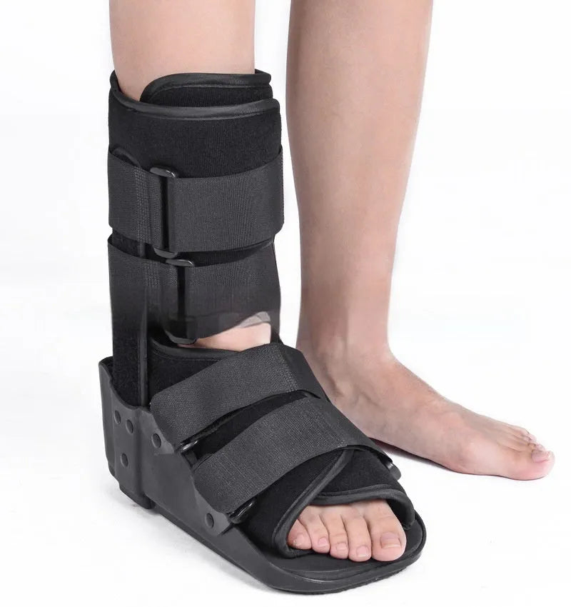 Grey Achilles tendon rehabilitation walking boot with fixed support design and adjustable sizing