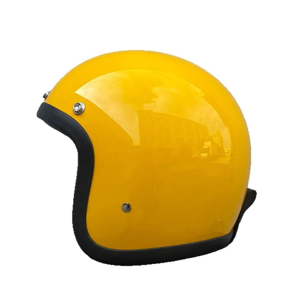 Retro style fibreglass half motorcycle helmet shown in a choice of colours like cement grey and matte black.