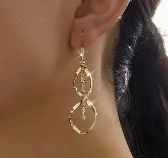 Gold geometric spiral drop earrings with oval detailing for women