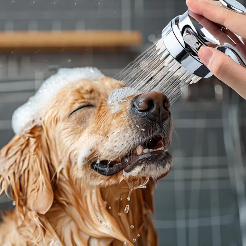 Silver 2-in-1 dog shower attachment with soft silicone comb teeth and ergonomic grip for home bathing