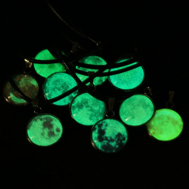 Luminous constellation glass pendant necklace with a moon and night sky design on an adjustable chain