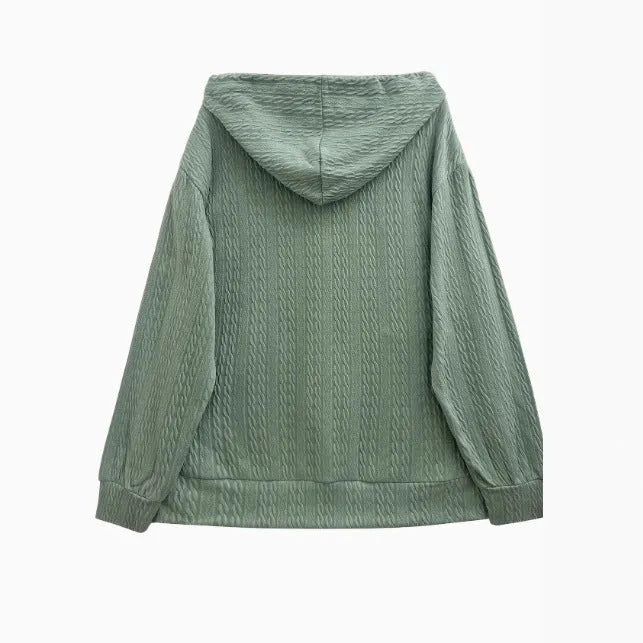 Green women's loose fit hooded sweater coat with a front zip closure on a hanger.