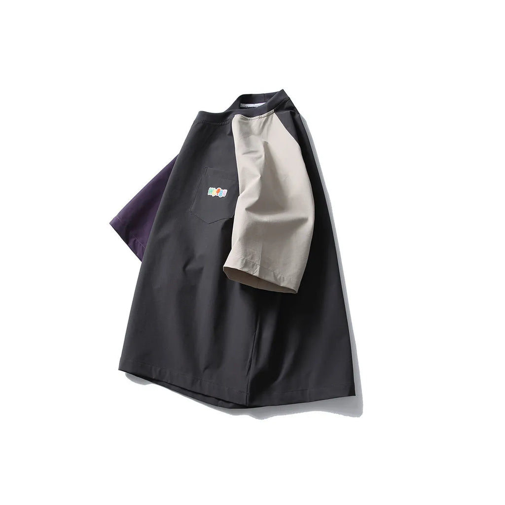 Dark grey men's loose fit t-shirt with contrasting colour raglan short sleeves.