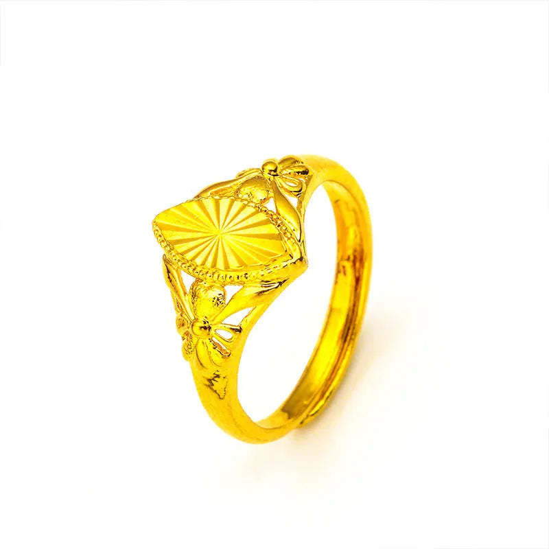 Gold open diamond flower ring with geometric floral pattern and textured brass construction