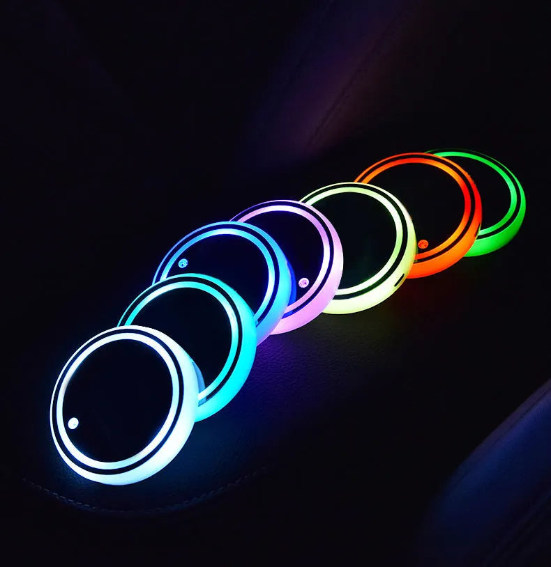 Colourful LED light-up coaster for car cup holder with solar panel and USB port.