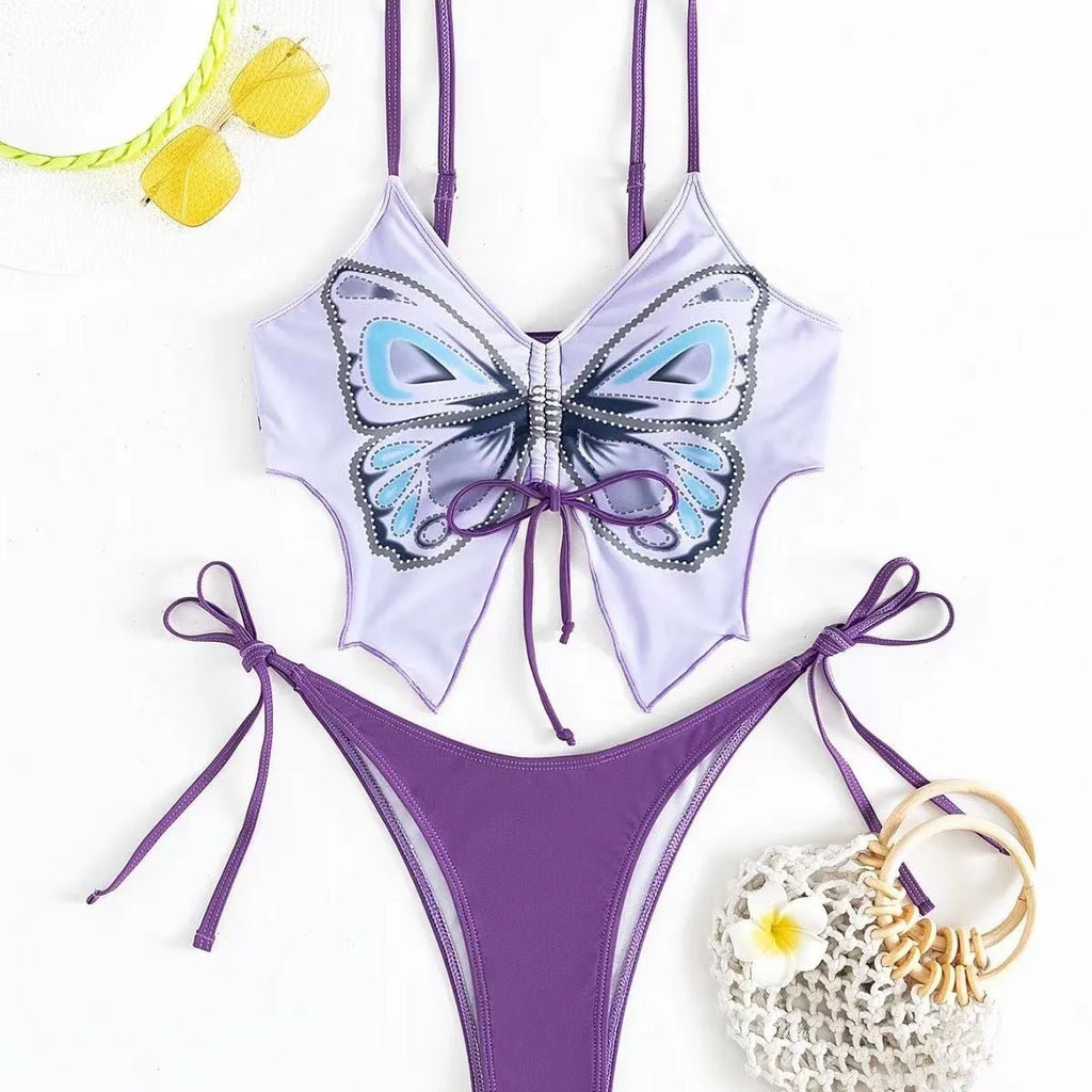 Women's purple bow ins style split bikini set with briefs, on a mannequin.