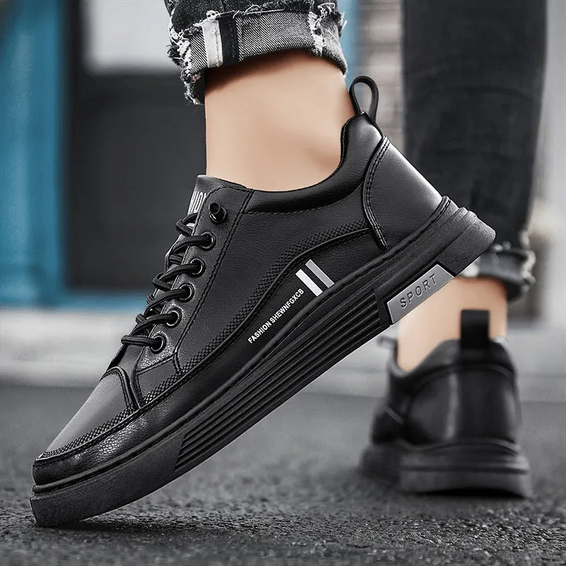 Men's low-top skate shoes with elastic band, microfiber upper, and round toe in black and white.