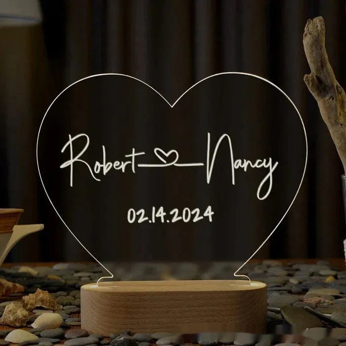 Personalised acrylic night light with engraved names and date, measuring 20cm by 11.5cm