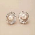 Pearl sterling silver needle earrings with gold electroplated finish and geometric design