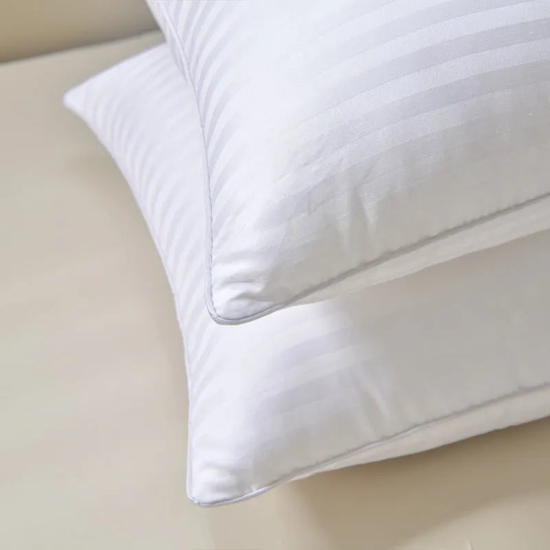 White cotton satin stripe feather pillow with duck down filling showing striped fabric detail