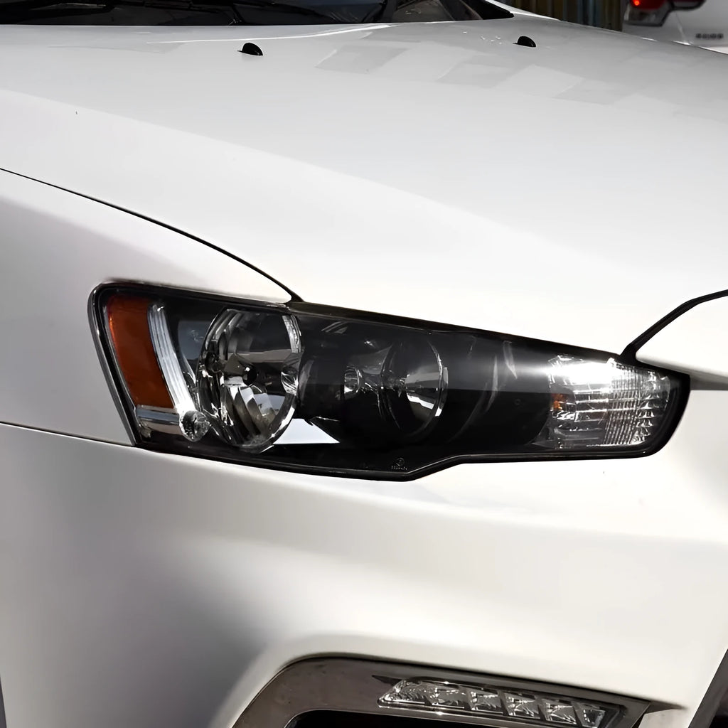 Transparent plastic headlight housing covers for driver and passenger positions