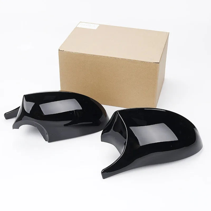 Pair of black ABS plastic rearview mirror shells for BMW 3 Series E90 door mirrors.