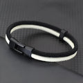 Black and white handmade woven hand strap showing Milan rope alloy construction