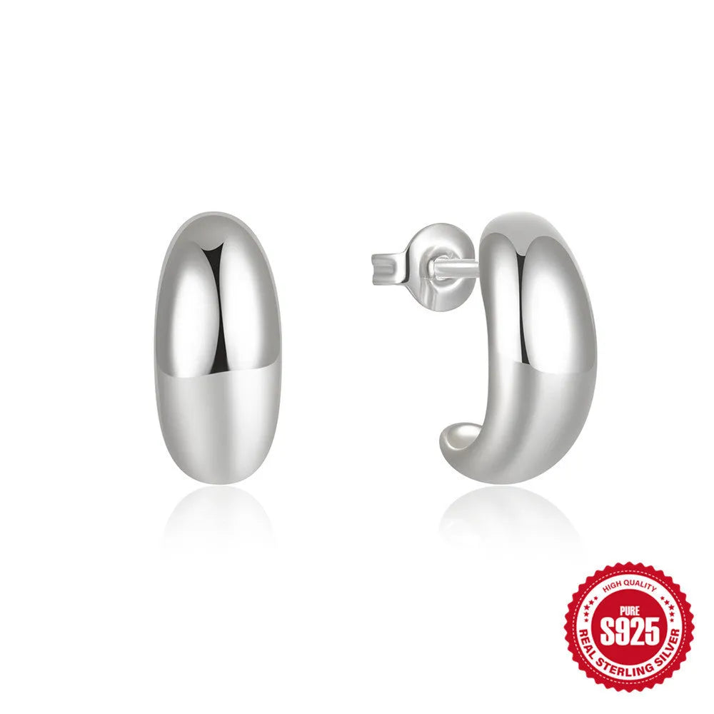 Sterling silver C-shaped stud earrings with electroplated gold finish, geometric design