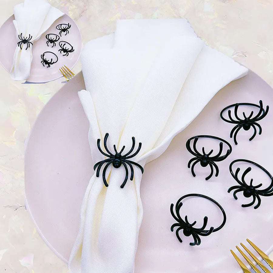 Six black spider-shaped alloy napkin rings for Halloween table decoration.